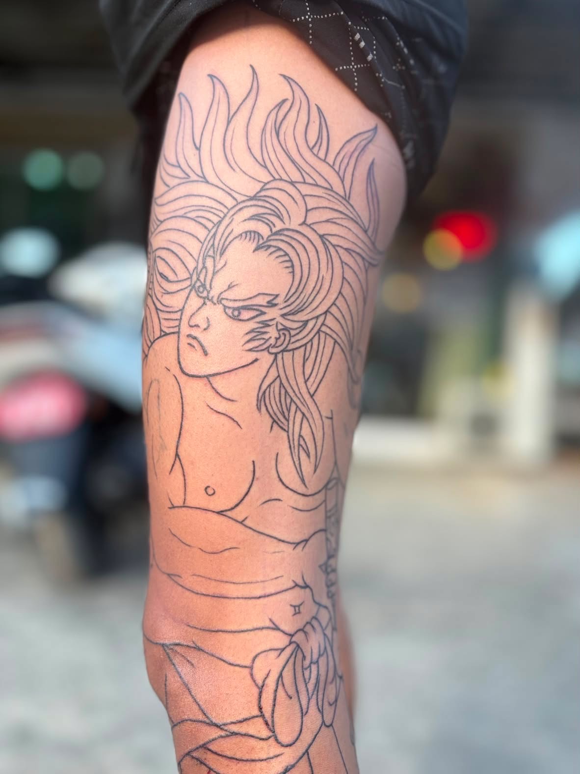 Fine line warrior thigh tattoo