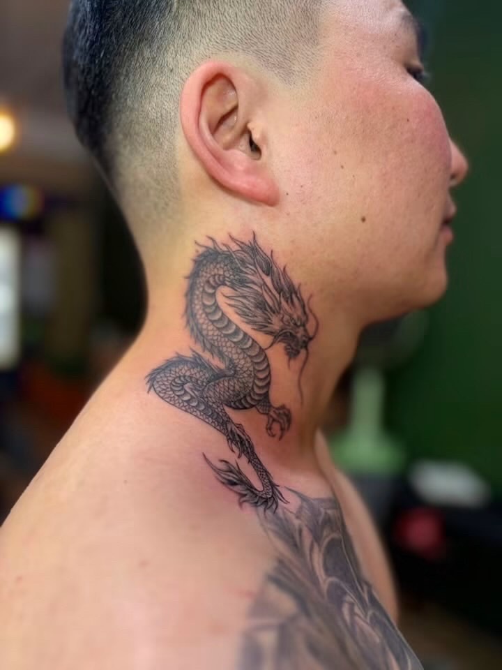 Fine line dragon neck tattoo