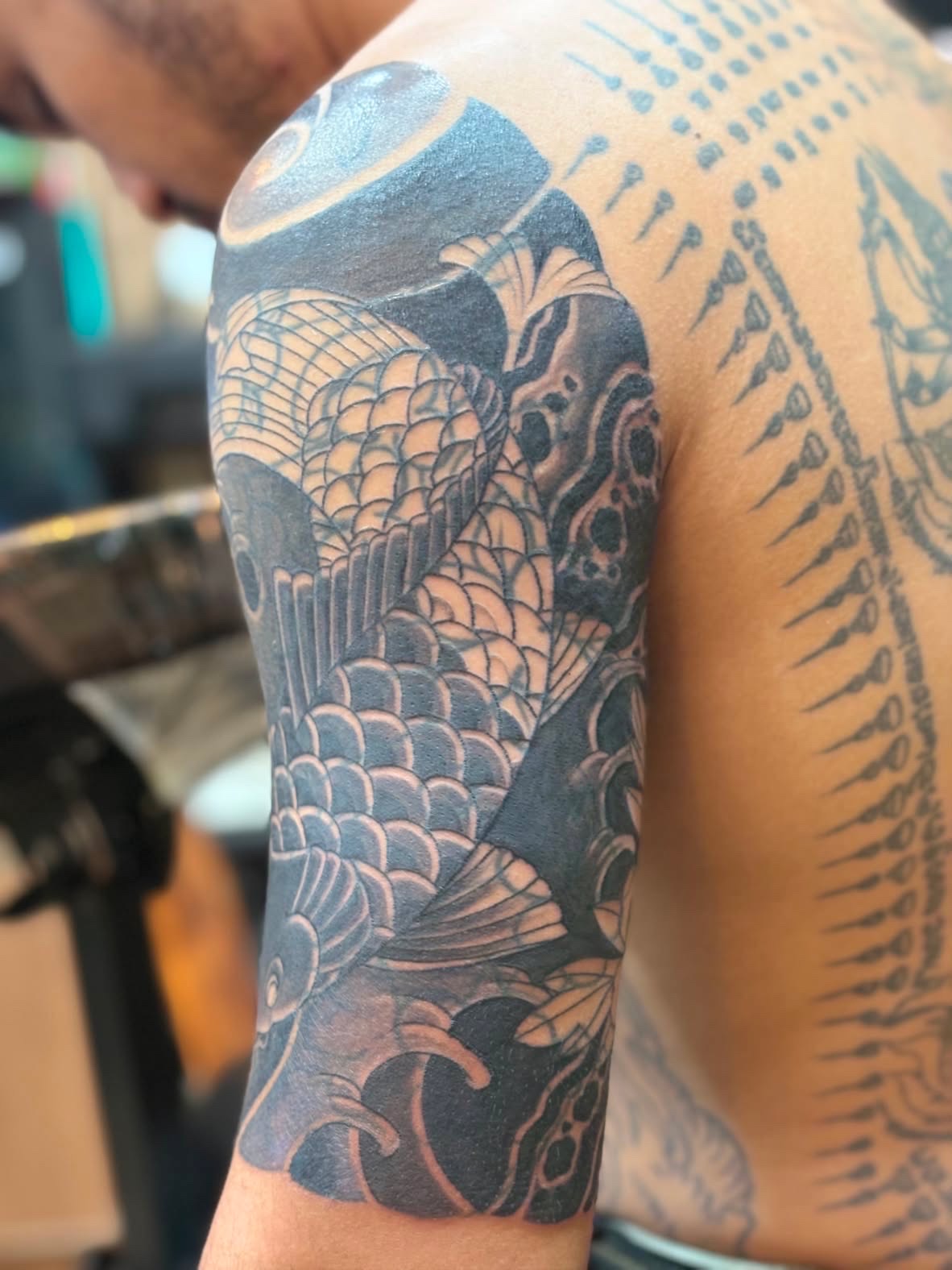 Koi fish sleeve with Sak Yant back