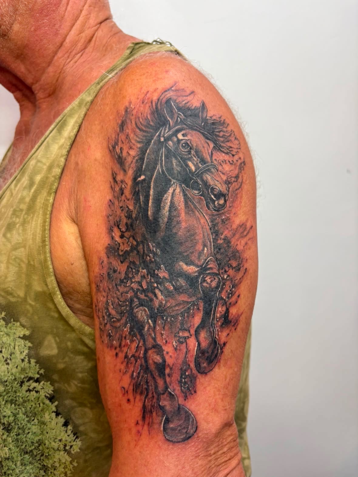 Realistic running horse tattoo