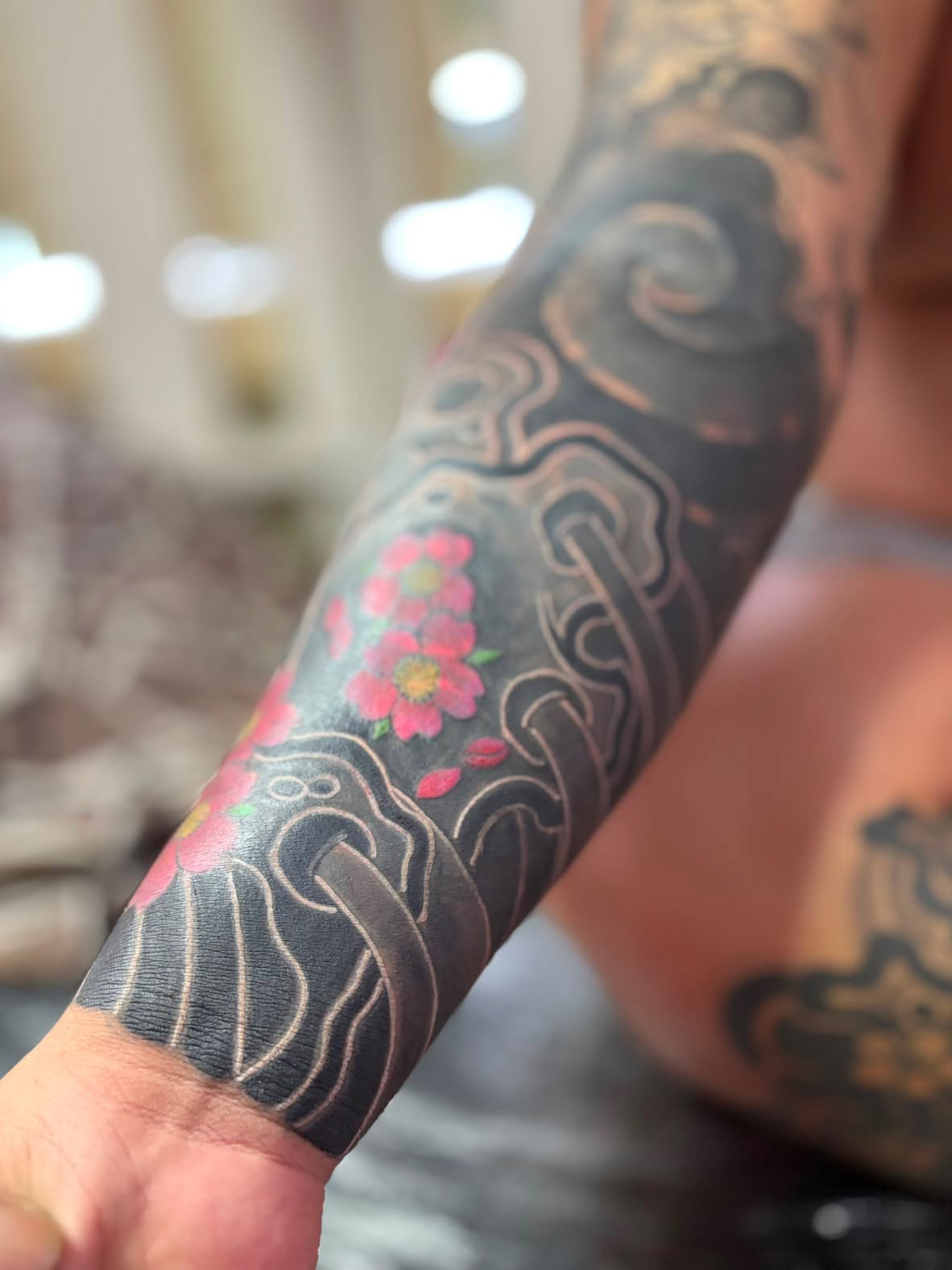 Japanese wave and blossom forearm